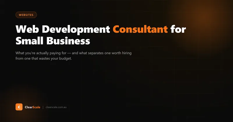 A web development consultant reviewing a small business website on a laptop and mobile device